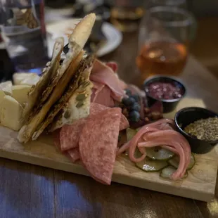 a platter of meats and cheeses