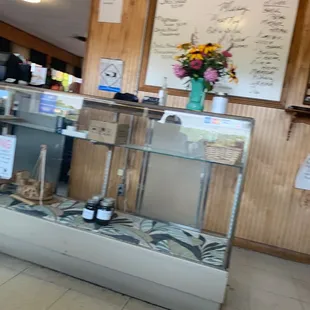 a counter with a vase of flowers