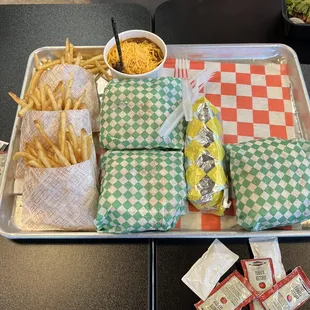 Fries, Cup of Chili, burgers and a chili dog.