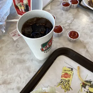 a hamburger and fries on a tray