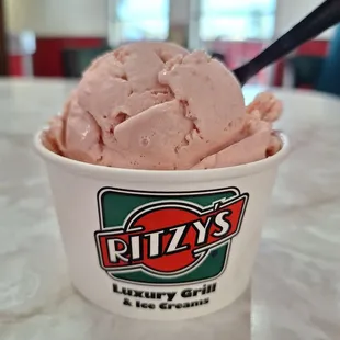 A perfect scoop of Strawberry Ice Cream on a hot summer evening. GET YOUR OWN!