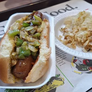 'Twas the Bratwurst before Christmas. Deck the brat with boughs of onions and peppers and a side of sauerkraut... YES. OBJECTIVE COMPLETED