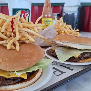 Double Ritzy Burgers on deck and ready for consumption! Piles of fries just straight loungin'.