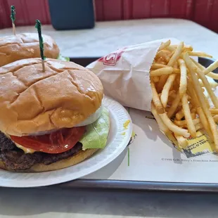 Double cheeseburger with everything and a side of fries.
