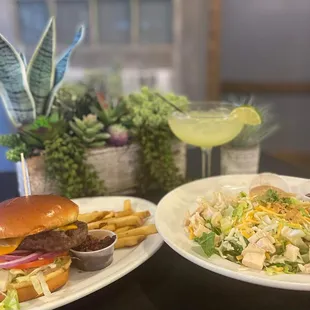 two plates of food and a drink