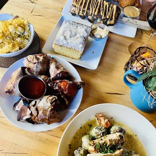 a wooden table with plates of food