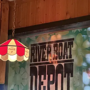 a hanging lamp and a sign