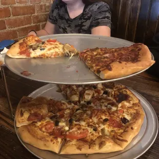 Special and courthouse on the bottom. Meat lovers and supreme on top