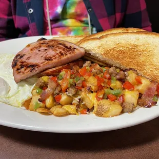 Eggs, ham, toast and loaded potatoes