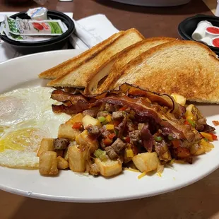 Eggs, bacon, toast and loaded potatoes