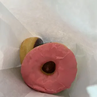Strawberry frosted (top) chocolate frosted, blueberry cake, glazed