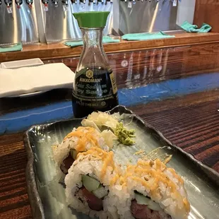 Half eaten Spicy Tuna Roll