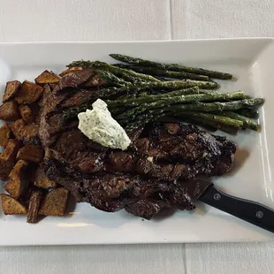 steak, asparagus, and potatoes