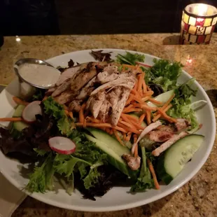 A fresh salad at chicken breast that had a pretty large serving of salad!