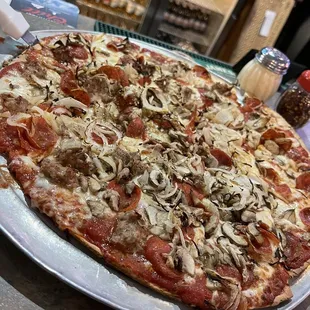 Large Thin Crust pizza with Pepperoni, Mushrooms, Onions. and half Italian Sausage
