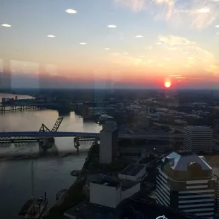 the sun setting over a city