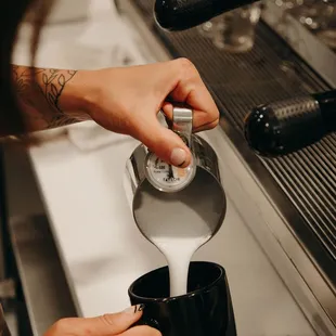 Foamy delicious latte pours