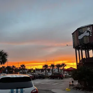 a parking lot with a water tower in the background
