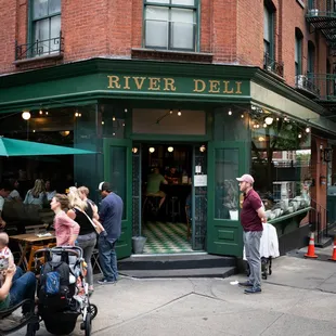 people eating outside of a restaurant