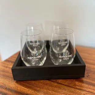 two wine glasses on a tray