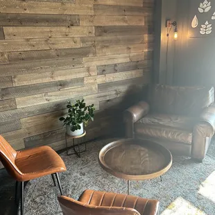 lounge area with leather chairs and coffee table