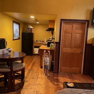 Kitchen, dining table, door to bathroom