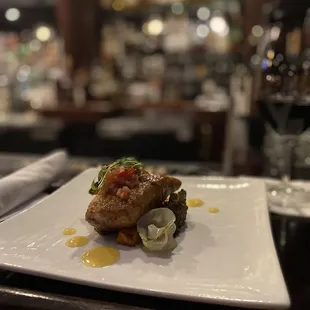 a plate of food on a bar