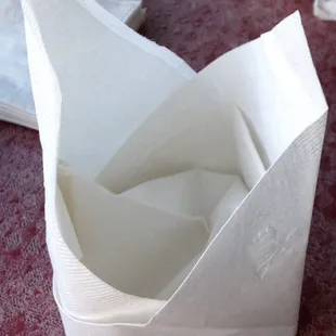 Cute napkin folding, but that time could be spent cleaning and refilling drinks.