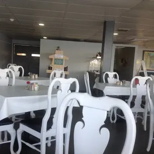 Matching tables and chairs and the ceiling has been white washed so it is easier/pleasurable to dine-in.