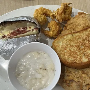 Chicken fried steak with fried shrimp and gravy