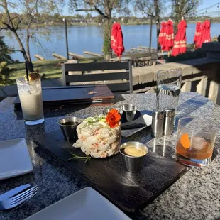 Crab tower and cocktails seated outside with a beautiful view and top notch service.