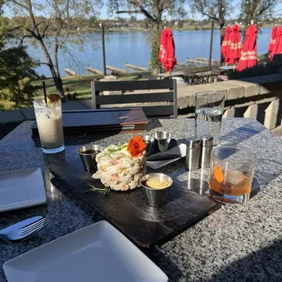 Crab tower and cocktails seated outside with a beautiful view and top notch service.