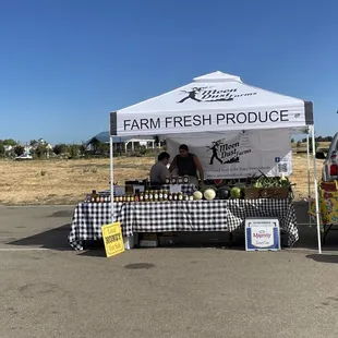 two farmers selling produce