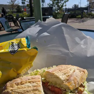 a sandwich and a bag of chips