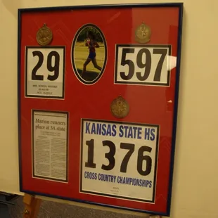 This was a collage of memorabilia commemorating one of our local high school athlete's cross country achievements...