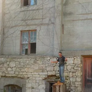 Mitch is dwarfed by the building and you can get an idea of the diameter of the tree with him as the perspective...