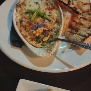 Seafood dip appetizer and Branzino entree. Hubby had Low Country Trout. We shared Bananas Foster Cheesecake for dessert.