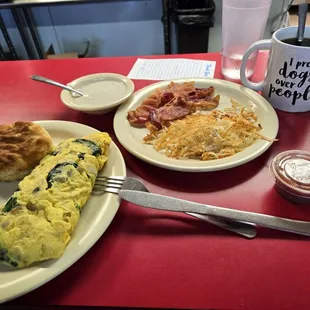 Spanish omllette with a side of bacon, hashbrown and biscuit and gravy.
