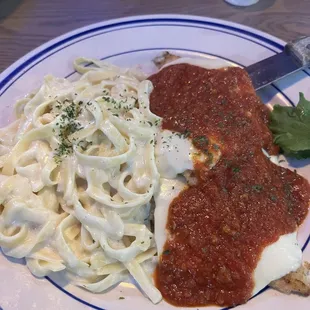 Chicken parmigiana with fettuccine Alfredo....great Italian food!