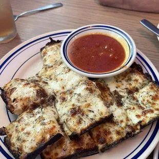 Cheesy Cheese Bread Bites are delicious. Tastes similar to Detroit style pizza with the crust