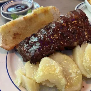 Ribs with Santa Anna potatoes. Sweet baby Ray&apos;s sauce. Super tender, fall off the bone