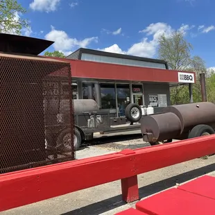 a bbq truck parked in front of a restaurant
