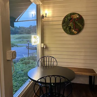 Seating and decor as well as their open sign!