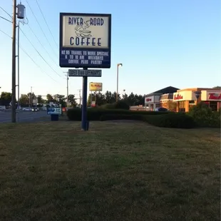 sign for river road coffee house