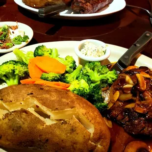 Loaded baked potato, steamed veggies, and filet mignon with mushroom sauce.