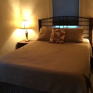 This is the total amount of light in this room, unless you can get behind the bed to open the shade.