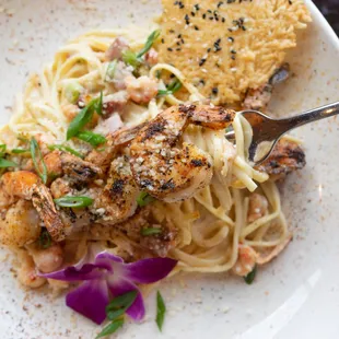 a plate of pasta and shrimp