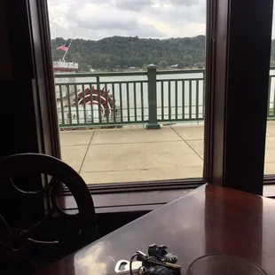 a glass of beer and keys on a table