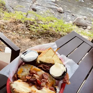 Melted cheese sandwich with loaded baked potato and a pineapple juice I do recommend getting the salad instead.