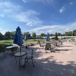 Outside patio overlooking 2 sand volleyball courts and river